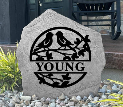 Custom engraved love birds garden stone featuring a monogram and decorative design.