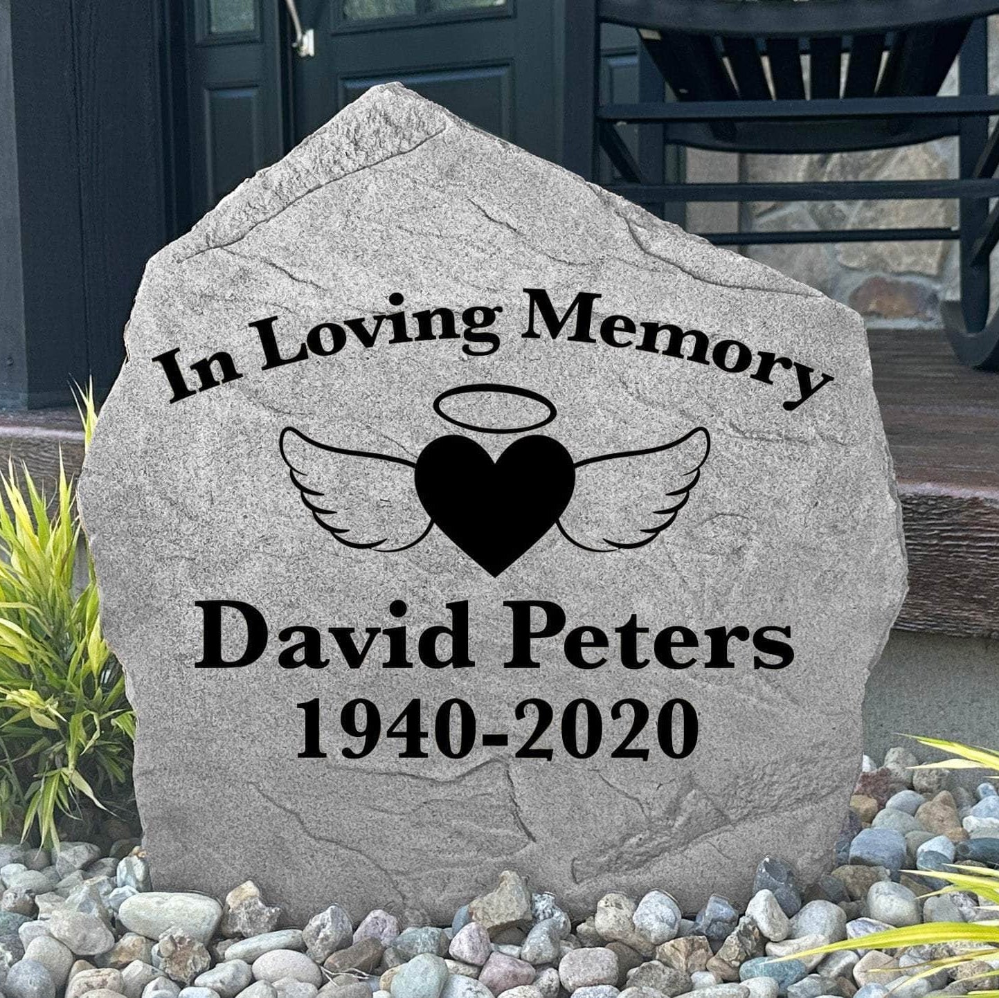 Decorative angel wings and heart remembrance stone crafted from durable concrete, creating a lasting tribute for memorial gardens and outdoor reflection spaces.