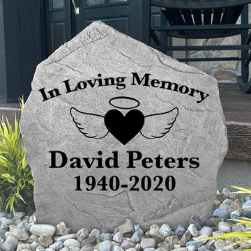 Decorative angel wings and heart remembrance stone crafted from durable concrete, creating a lasting tribute for memorial gardens and outdoor reflection spaces.
