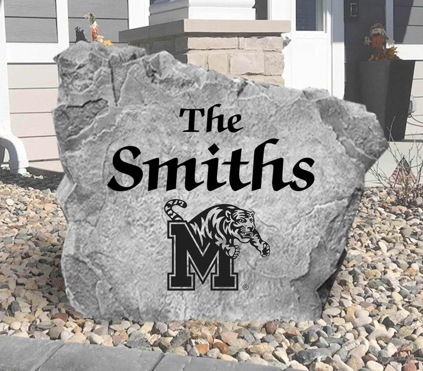 Engraved Memphis Tigers family name rock for yard display.