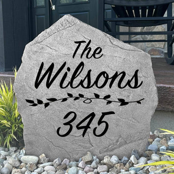 Custom family name and address plaque crafted from durable concrete, combining elegant curb appeal with easy-to-read home identification.