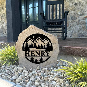 Decorative Forest Monogram Stone featuring detailed forest accents and a custom monogram permanently engraved into the stone surface. Perfect for cabins, gardens, and entryways, this outdoor stone adds timeless rustic appeal.