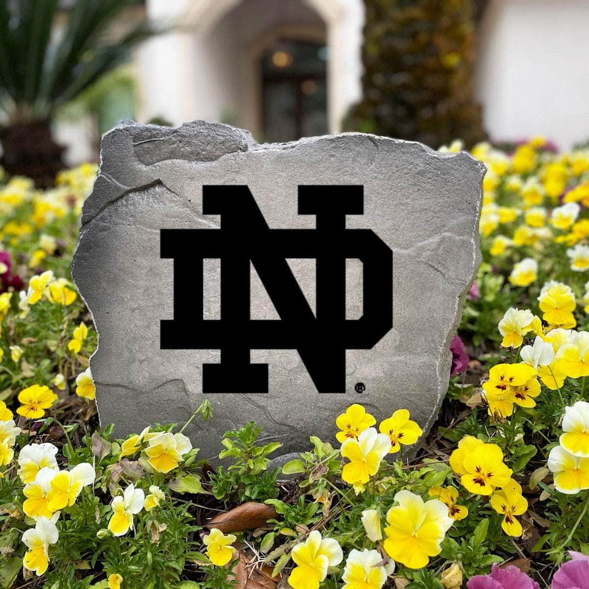 Officially licensed Notre Dame Fighting Irish Logo Stone handcrafted in the USA with detailed team engraving and durable construction. This decorative garden stone enhances landscape beds and outdoor spaces with lasting beauty and school spirit.