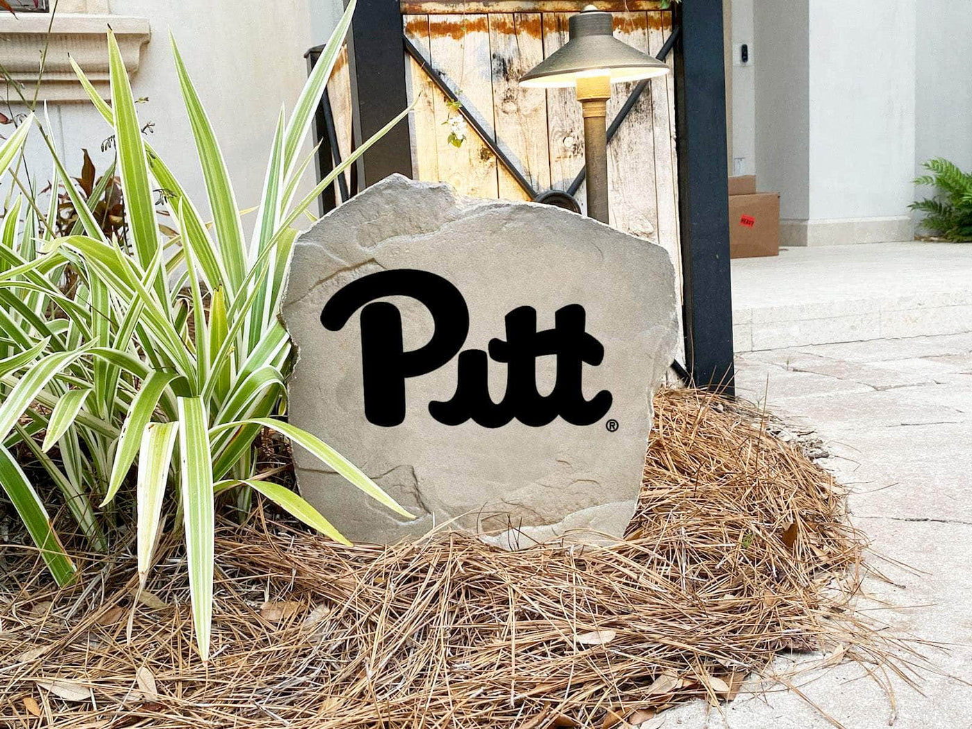 Decorative landscaping stone showcasing Pitt Panthers pride