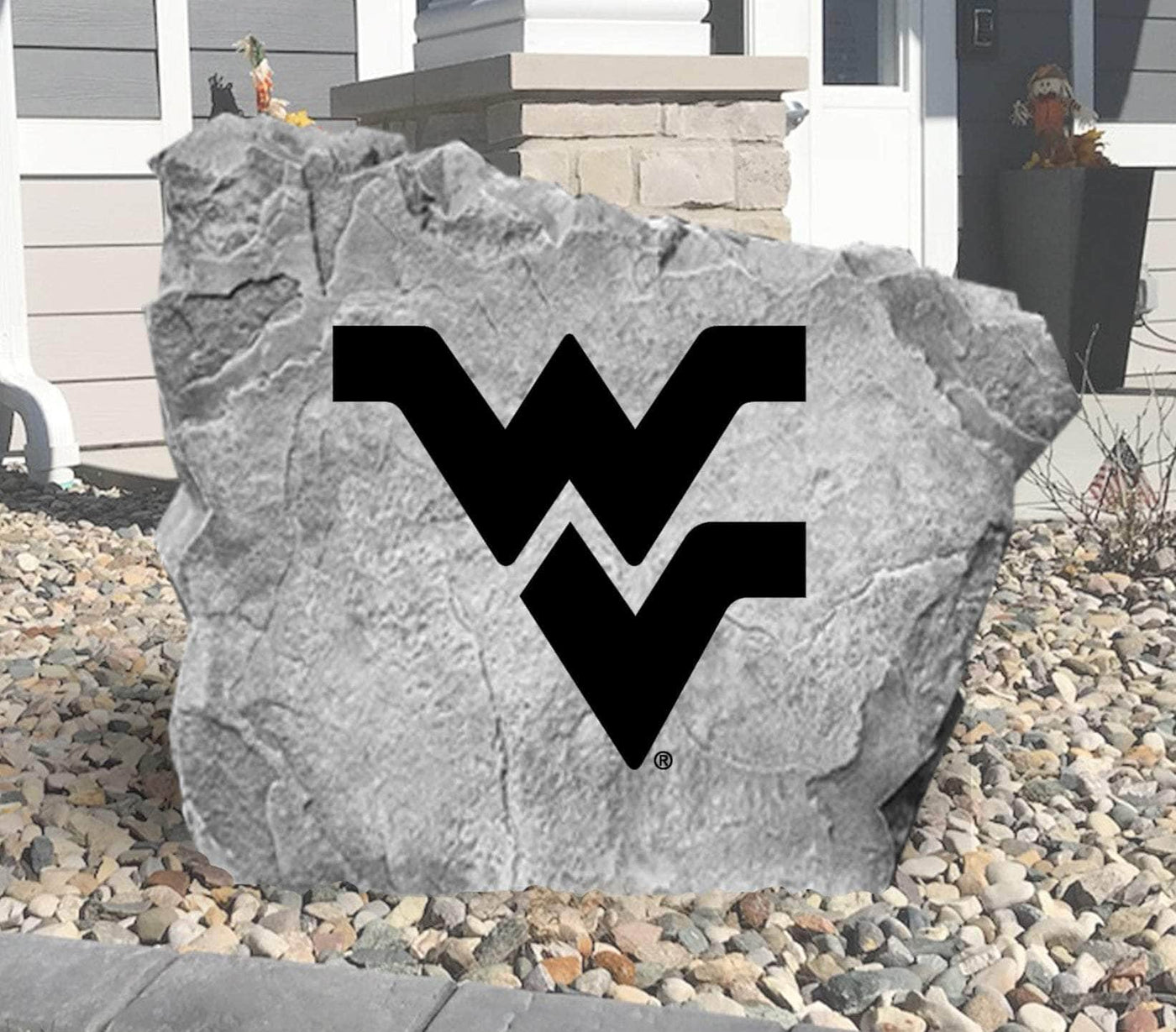 Outdoor decorative rock featuring the West Virginia University emblem