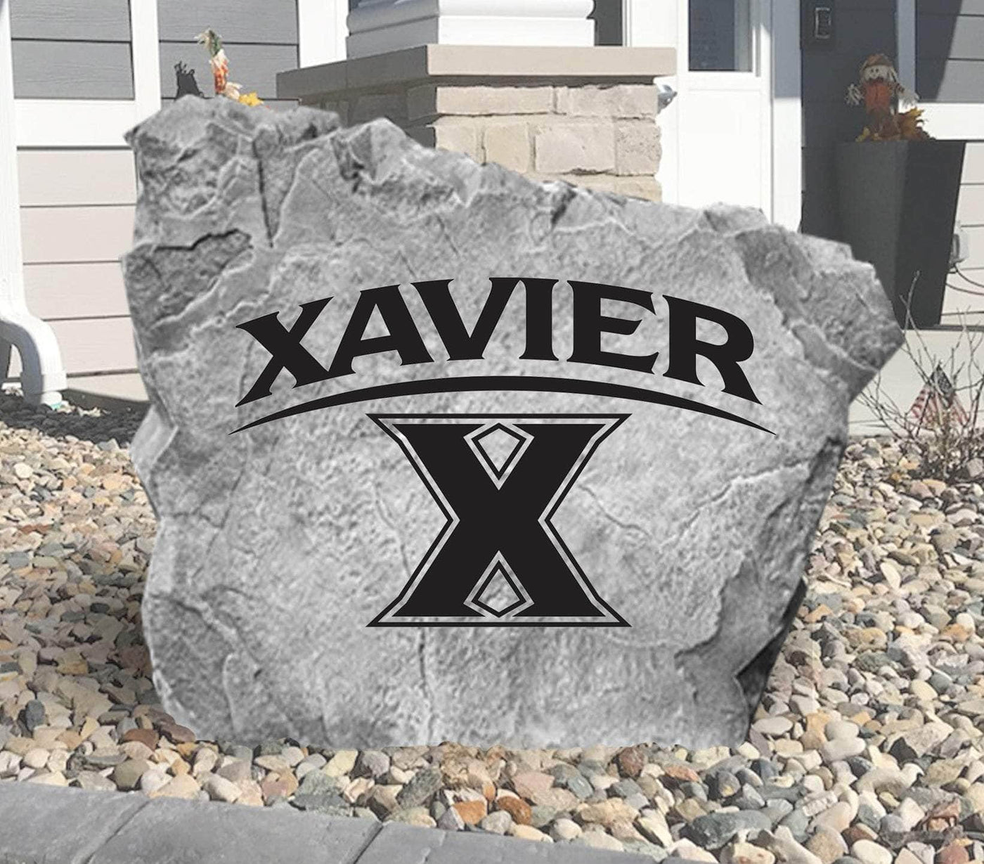 Personalized Xavier University logo rock for front yard display