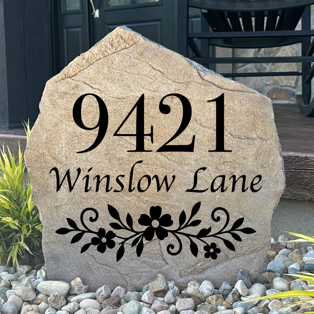 Gracefully framed by colorful blooms and lush greenery, the Floral Address Stone combines elegant botanical accents with personalized house numbers to create a welcoming first impression. Its detailed engraving and timeless design bring refined curb appeal to garden beds, walkways, and front entrances, making the home easy to find while adding lasting beauty.