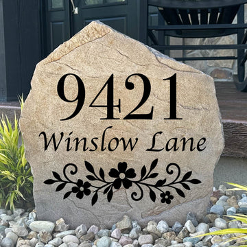 Gracefully framed by colorful blooms and lush greenery, the Floral Address Stone combines elegant botanical accents with personalized house numbers to create a welcoming first impression. Its detailed engraving and timeless design bring refined curb appeal to garden beds, walkways, and front entrances, making the home easy to find while adding lasting beauty.