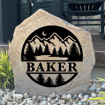 Personalized Forest Monogram Stone featuring a custom initial surrounded by woodland-inspired artwork engraved directly into the stone surface. This decorative garden stone adds rustic charm and curb appeal to front yards, cabins, patios, and entryways.