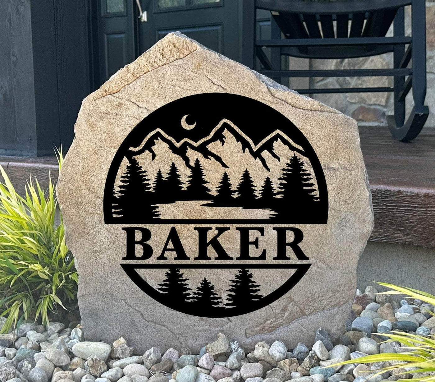 Personalized forest monogram stone with trees and mountains, perfect for outdoor décor.