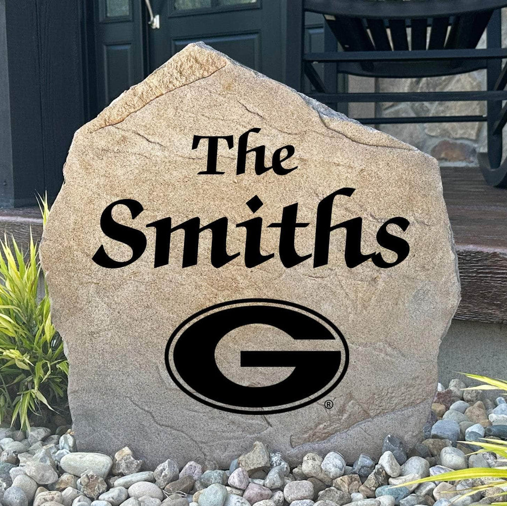 Officially licensed University of Georgia Name Stone featuring a personalized family name and the iconic Georgia Bulldogs logo engraved directly into the stone surface. This custom garden stone adds school pride and curb appeal to front yards, patios, gardens, and entryways.