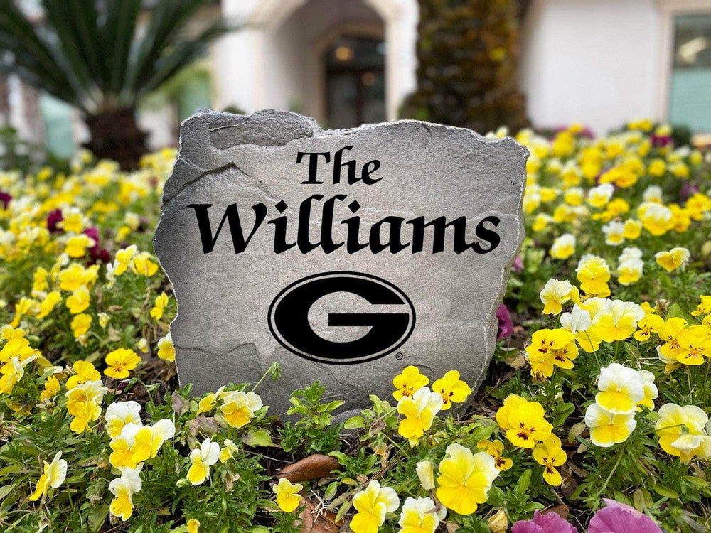 Officially licensed Georgia Bulldogs Name Stone handcrafted in the USA with custom family engraving and detailed team artwork. This decorative garden stone enhances landscape beds, patios, and outdoor living spaces with lasting beauty and school spirit.