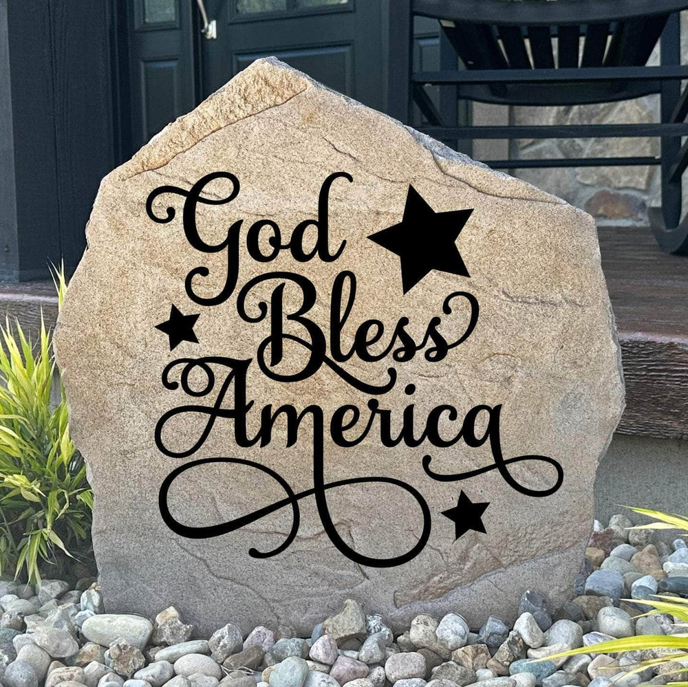 Engraved God Bless America Stone featuring a patriotic design carved directly into the stone surface. This decorative garden stone adds American pride and timeless curb appeal to front yards, patios, gardens, and entryways.