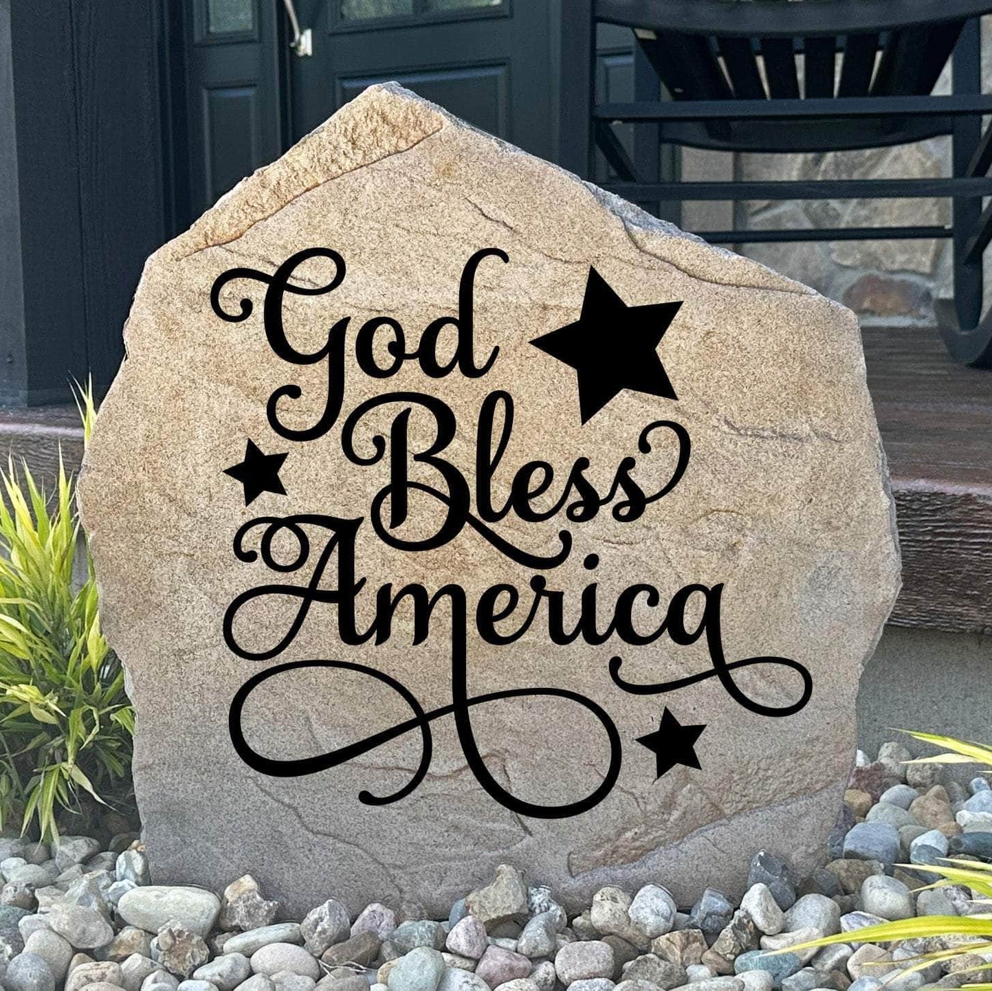 Engraved God Bless America Stone featuring a patriotic design carved directly into the stone surface. This decorative garden stone adds American pride and timeless curb appeal to front yards, patios, gardens, and entryways.