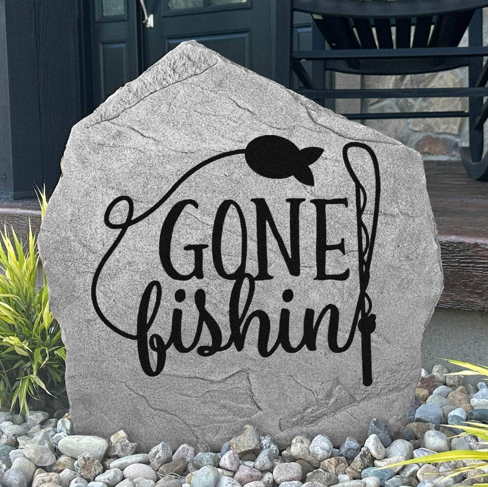 Gone Fishin' engraved stone bringing classic fishing cabin charm to lake houses, docks, gardens, and waterfront landscapes.