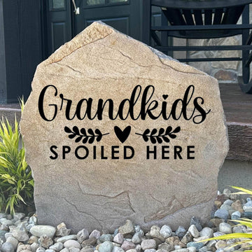 Personalized Grandkids Spoiled Here Stone featuring a heartwarming engraved design that celebrates the special bond between grandparents and grandchildren. This decorative garden stone adds warmth and charm to front entryways, patios, gardens, and landscape beds.