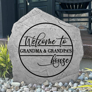 Custom Grandma & Grandpa's House Stone displayed in a landscaped flower bed, celebrating family and creating a charming focal point for walkways, porches, and outdoor living spaces.