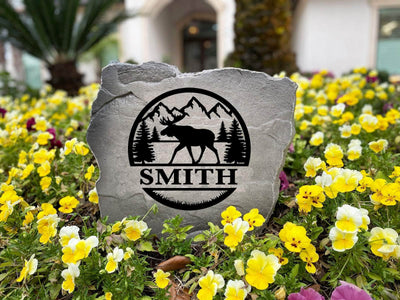 Personalized moose-themed outdoor decor stone for family or wildlife lovers.