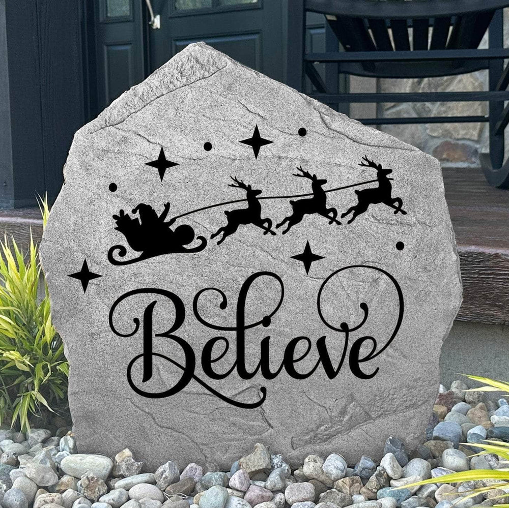Believe Holiday Stone displayed in a beautifully decorated outdoor setting, showcasing elegant engraving and timeless craftsmanship. This festive outdoor accent creates a welcoming focal point for Christmas décor and holiday gatherings.