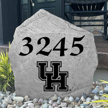 Custom University of Houston Address Stone displayed in a landscaped flower bed, showcasing personalized house numbers and officially licensed Houston Cougars artwork. This engraved address stone creates a beautiful focal point for alumni homes and outdoor spaces.