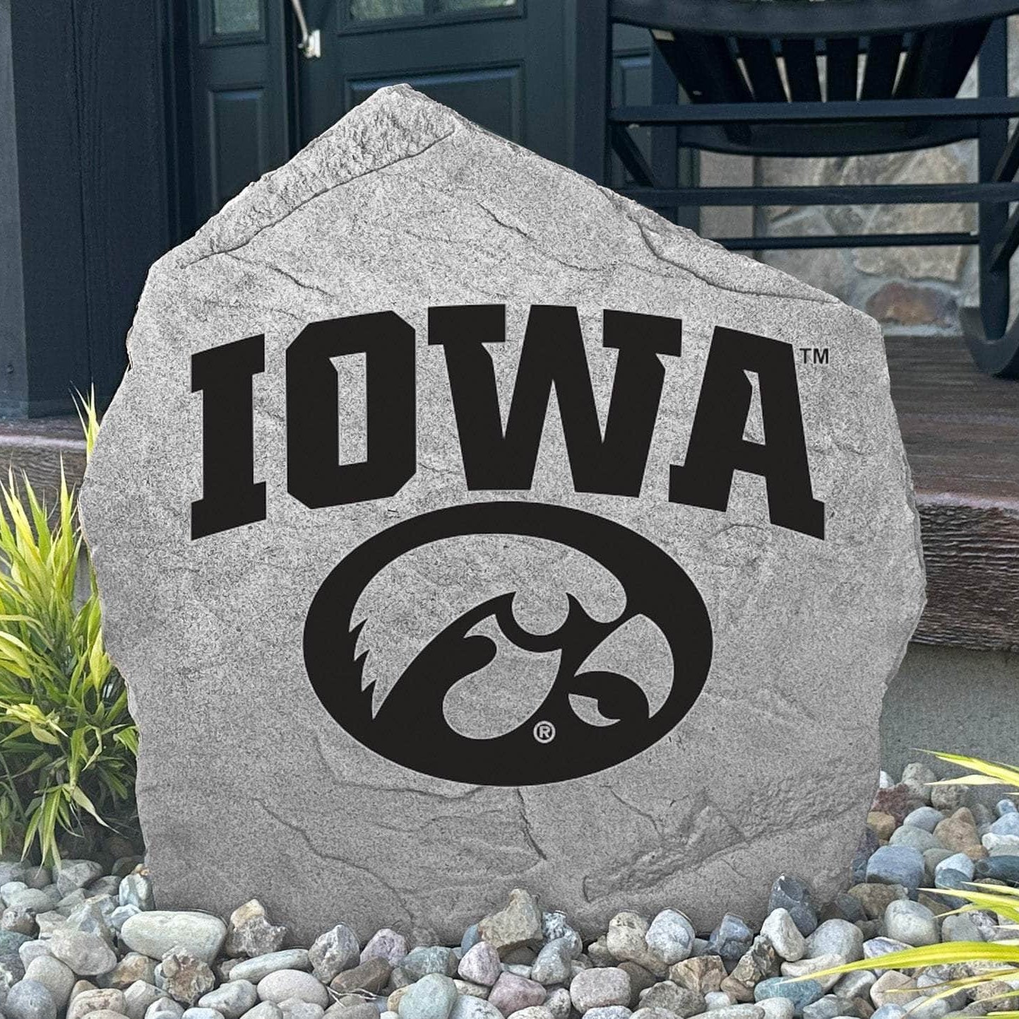 Engraved Iowa Hawkeyes team logo on natural stone