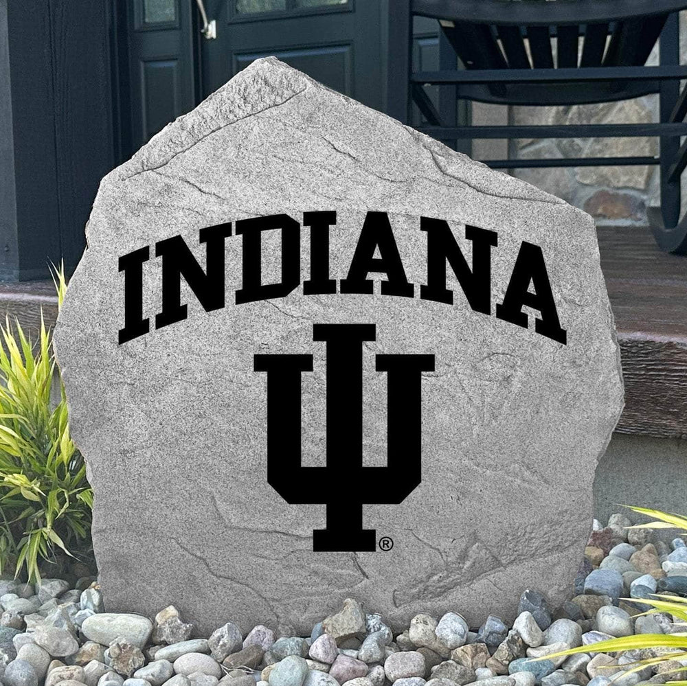 Custom Indiana Hoosiers Logo Stone displayed in a landscaped flower bed, showcasing officially licensed team artwork permanently engraved into the stone. This outdoor accent creates a beautiful focal point for alumni homes and devoted Hoosiers fans.