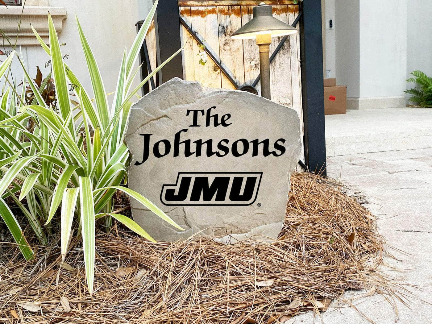 Decorative yard stone featuring JMU logo and family name