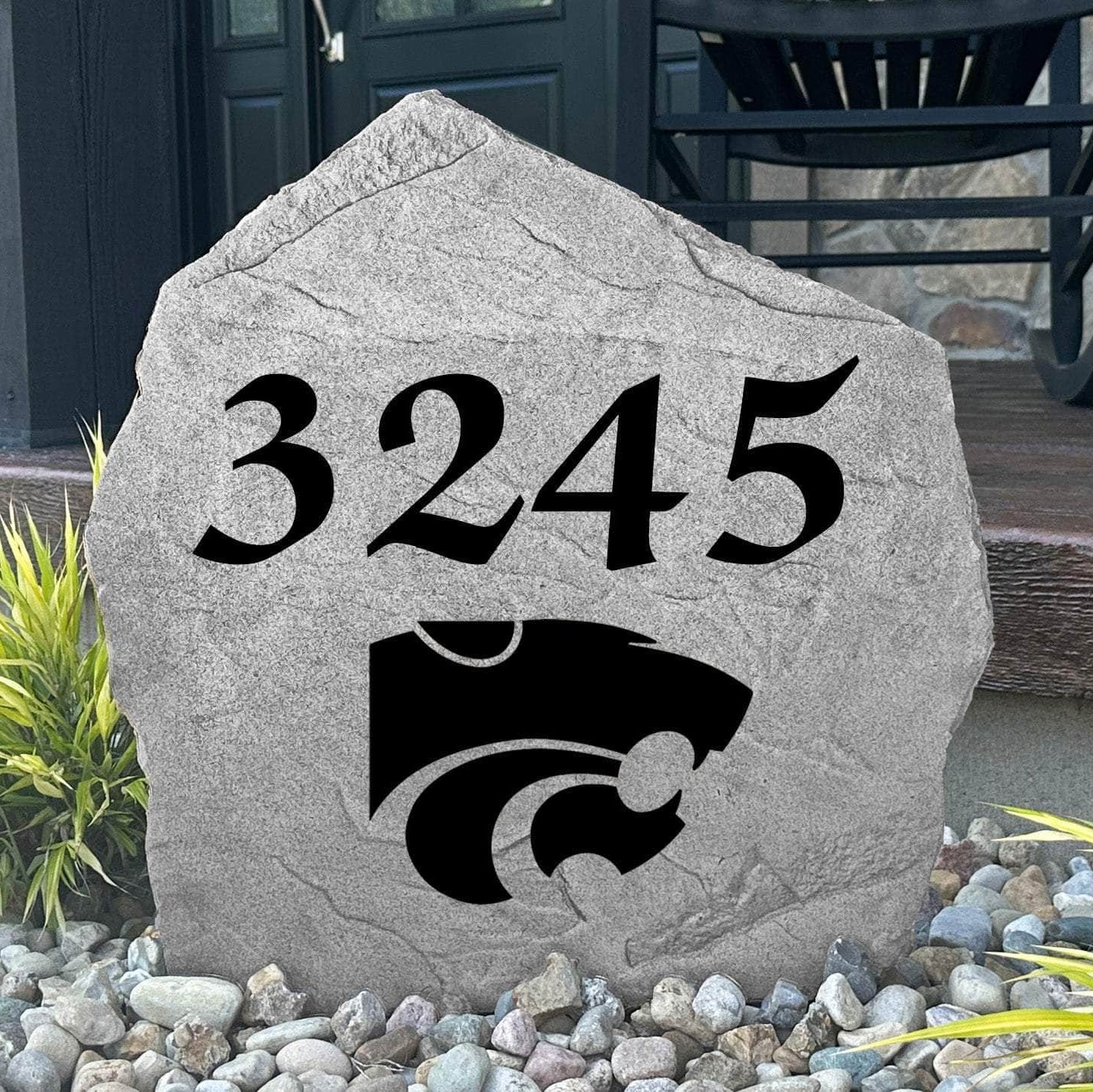 Custom Kansas State University Address Stone displayed in a landscaped flower bed with personalized house numbers and officially licensed Wildcats artwork. This engraved address marker creates a striking focal point for alumni homes and devoted Kansas State fans.