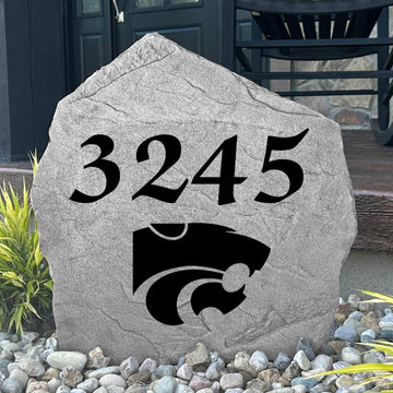 Custom Kansas State University Address Stone displayed in a landscaped flower bed with personalized house numbers and officially licensed Wildcats artwork. This engraved address marker creates a striking focal point for alumni homes and devoted Kansas State fans.