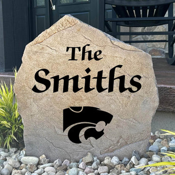 Officially licensed Kansas State University Name Stone featuring a personalized family name and the iconic Kansas State Wildcats logo engraved directly into the stone surface. This custom garden stone adds school pride and curb appeal to front yards, patios, gardens, and entryways.