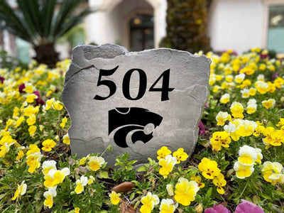 Outdoor decor stone featuring K-State logo and address