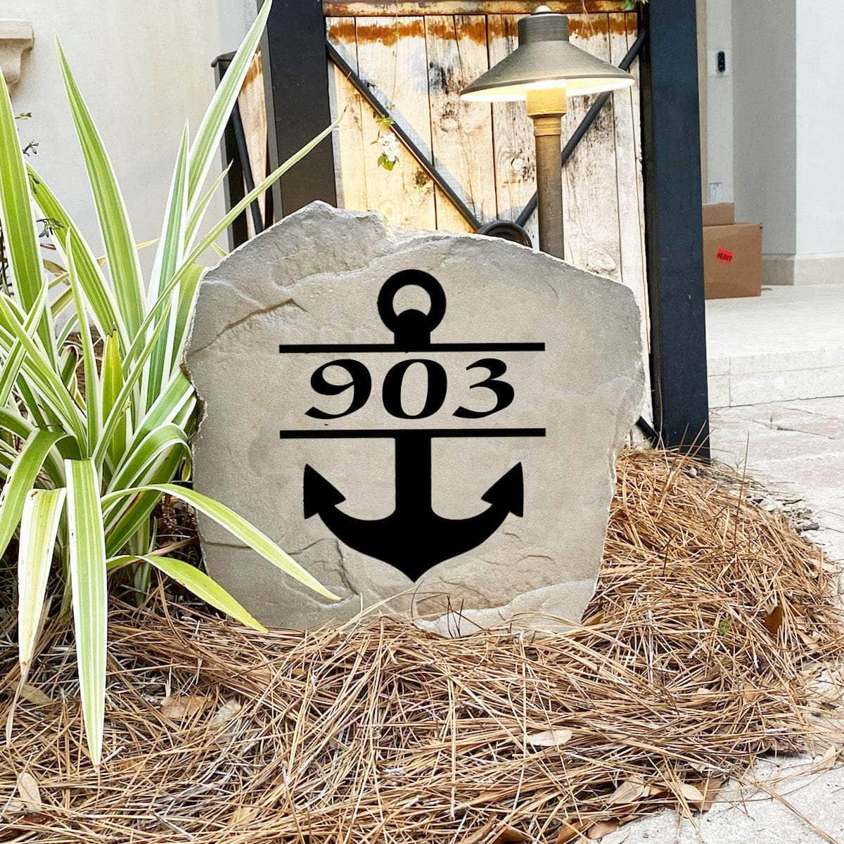Nautical address landscape stone featuring a decorative anchor and personalized street numbers, perfect for front yards, docks, walkways, and entryways.