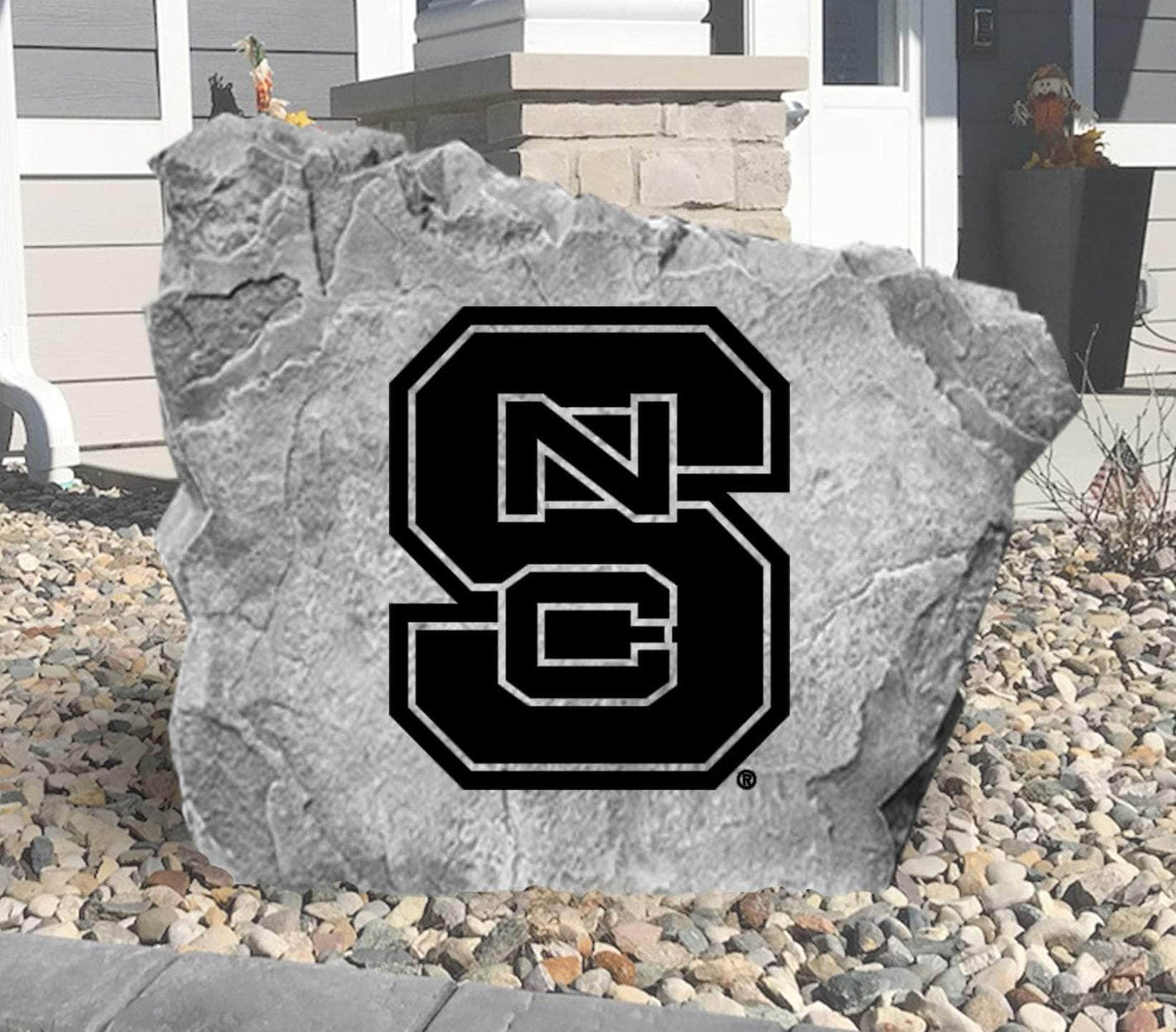 Outdoor rock featuring North Carolina State University emblem