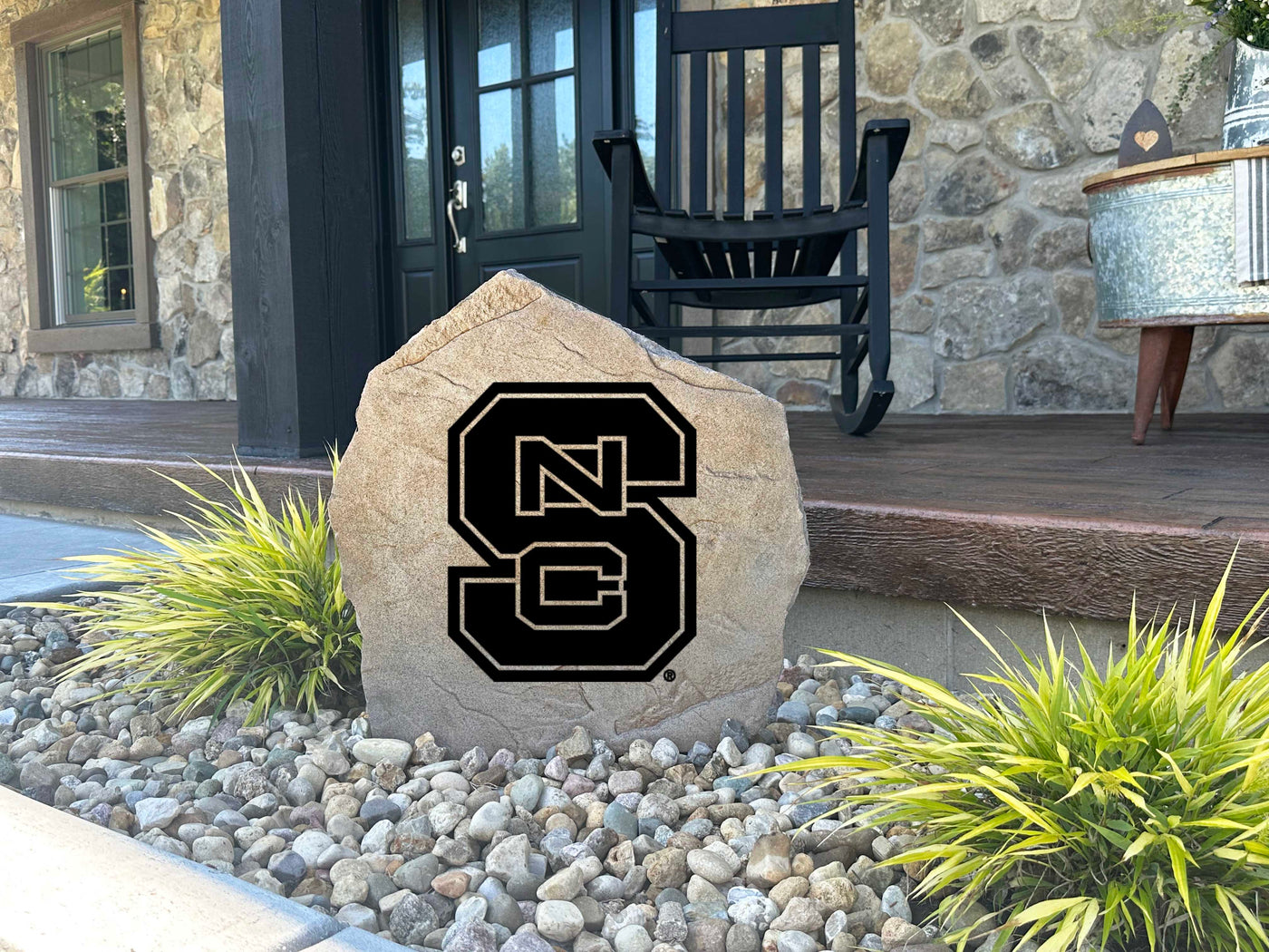 Landscaping stone showcasing the NC State Wolfpack symbol