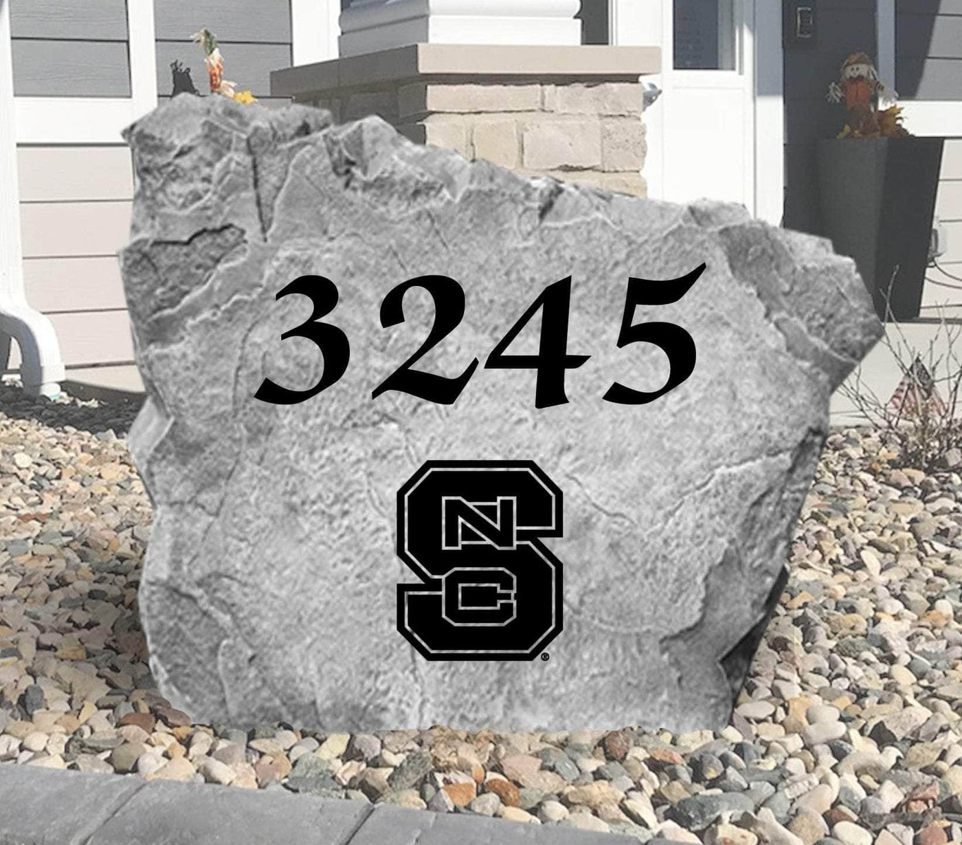 Outdoor rock with NC State Wolfpack logo engraving