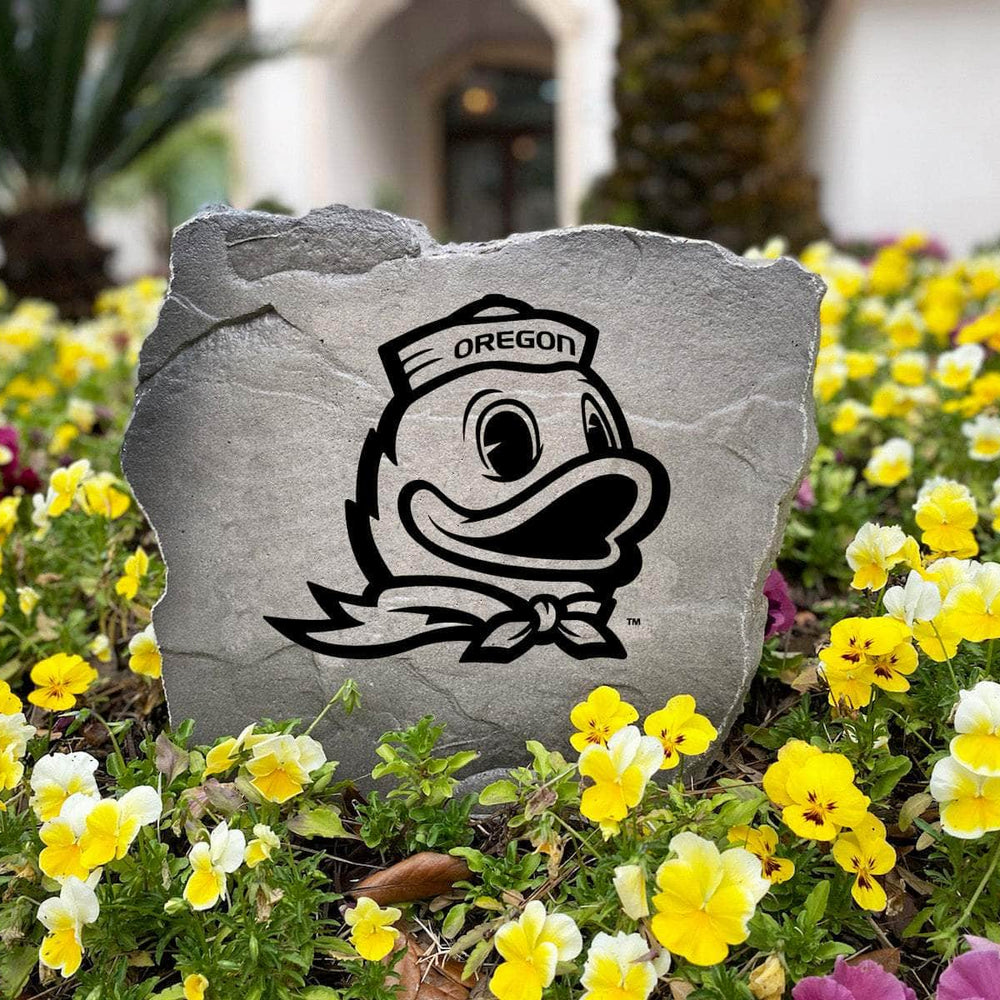 Officially licensed Oregon Ducks Duck Logo Stone handcrafted in the USA with detailed mascot engraving and weather-resistant durability. This decorative garden stone enhances landscape beds and outdoor spaces with lasting beauty and school spirit.