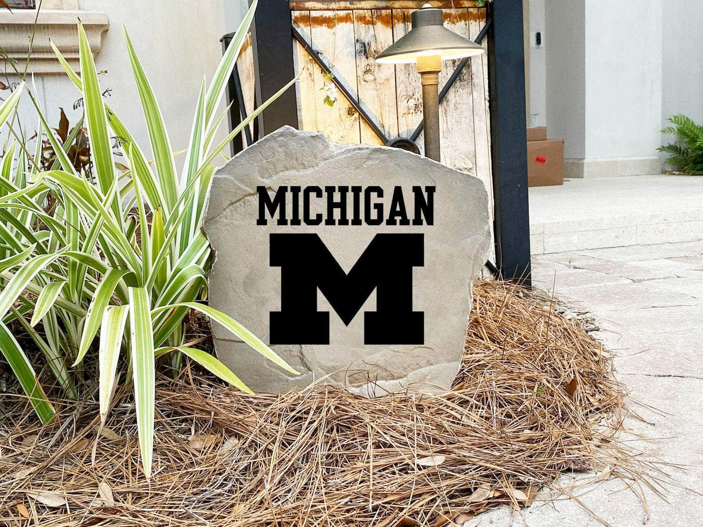Outdoor stone with official NCAA Michigan logo, ideal for landscaping and curb appeal.