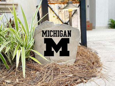 Outdoor stone with official NCAA Michigan logo, ideal for landscaping and curb appeal.