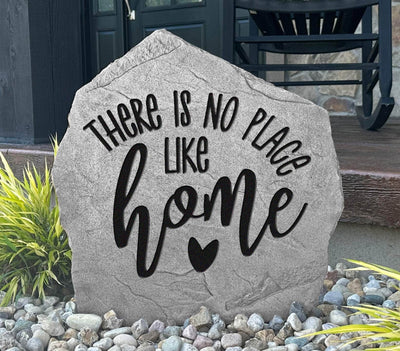 Outdoor decorative stone featuring the phrase no place like home.