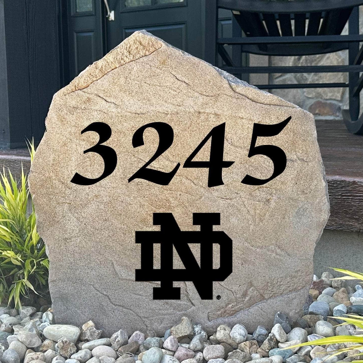 Officially licensed University of Notre Dame Address Stone featuring custom house numbers and the iconic Fighting Irish logo engraved directly into the stone surface. This personalized address marker adds school pride and curb appeal to front yards, gardens, driveways, and entryways.
