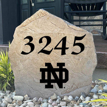 Officially licensed University of Notre Dame Address Stone featuring custom house numbers and the iconic Fighting Irish logo engraved directly into the stone surface. This personalized address marker adds school pride and curb appeal to front yards, gardens, driveways, and entryways.