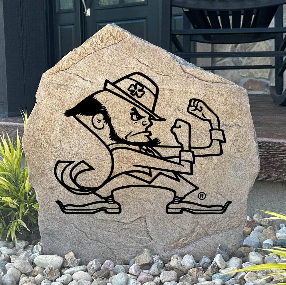 Officially licensed University of Notre Dame Leprechaun Stone featuring the iconic Fighting Irish Leprechaun logo engraved directly into the stone surface. This decorative garden stone adds school pride and curb appeal to front yards, patios, gardens, and entryways.