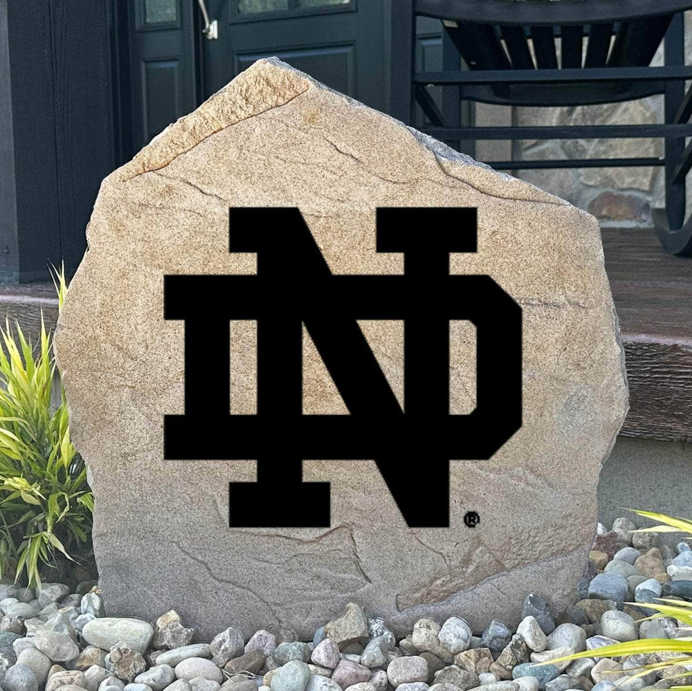 Officially licensed University of Notre Dame Logo Stone featuring the iconic Notre Dame Fighting Irish logo engraved directly into the stone surface. This decorative garden stone adds school spirit and curb appeal to front yards, patios, gardens, and entryways.