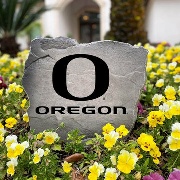 Decorative Oregon Ducks Logo Stone with officially licensed team graphics carved directly into the stone surface. Ideal for gardens, patios, fan caves, and entryways, this outdoor décor celebrates Oregon tradition.