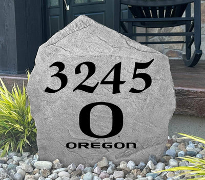 Outdoor rock featuring Oregon Ducks branding and personalized home address.