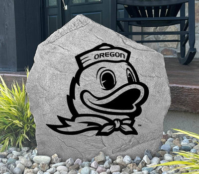 Outdoor rock with iconic Oregon Ducks logo, ideal for landscaping or gifting.