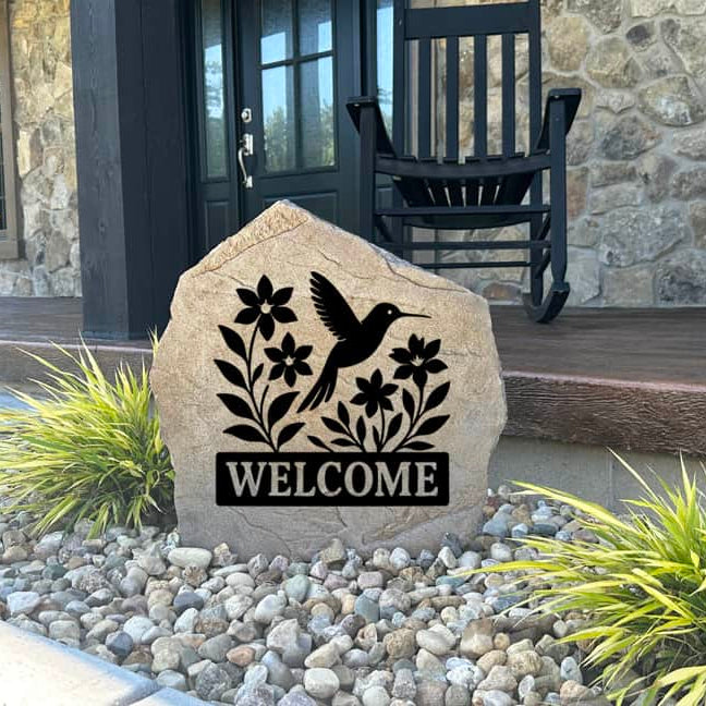Decorative Welcome Hummingbird Stone with delicate hummingbird details permanently engraved into the stone. Perfect for flower gardens, patios, and front porches, this outdoor sign creates a warm and welcoming atmosphere.