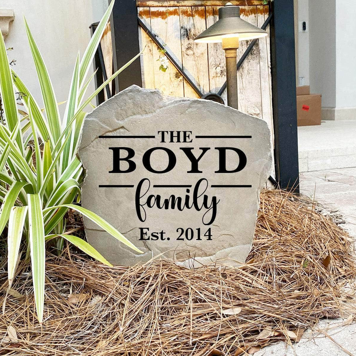 Decorative Family Name Stone featuring personalized family lettering permanently engraved into the stone surface. Perfect for gardens, patios, landscape beds, and entryways, this outdoor accent enhances curb appeal with timeless style.