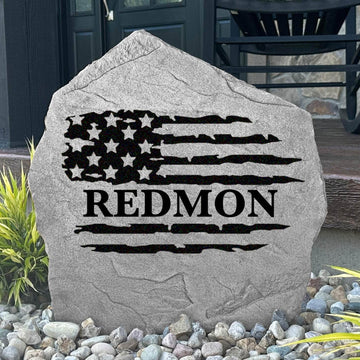 Personalized American flag name stone engraved with your family name, creating a patriotic centerpiece for front yards, gardens, and entryway landscaping.