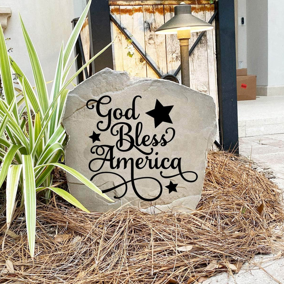 Decorative God Bless America Stone with permanently engraved patriotic details designed to enhance gardens, entryways, patios, and landscape borders. This outdoor accent celebrates American pride with lasting beauty.